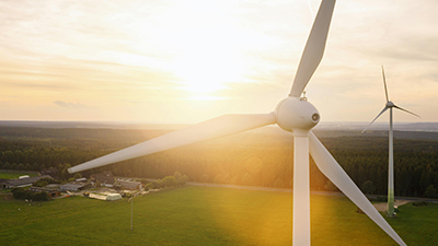 Wind turbines in a field covered by sunshine
